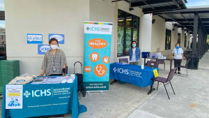 ICHS staff welcome visitors to Viet-Wah entrance pop-up COVID vaccine clinic