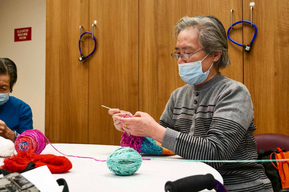 Legacy House resident knitting ICHS